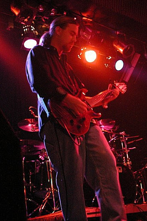 C. Michael Pilato playing the guitar